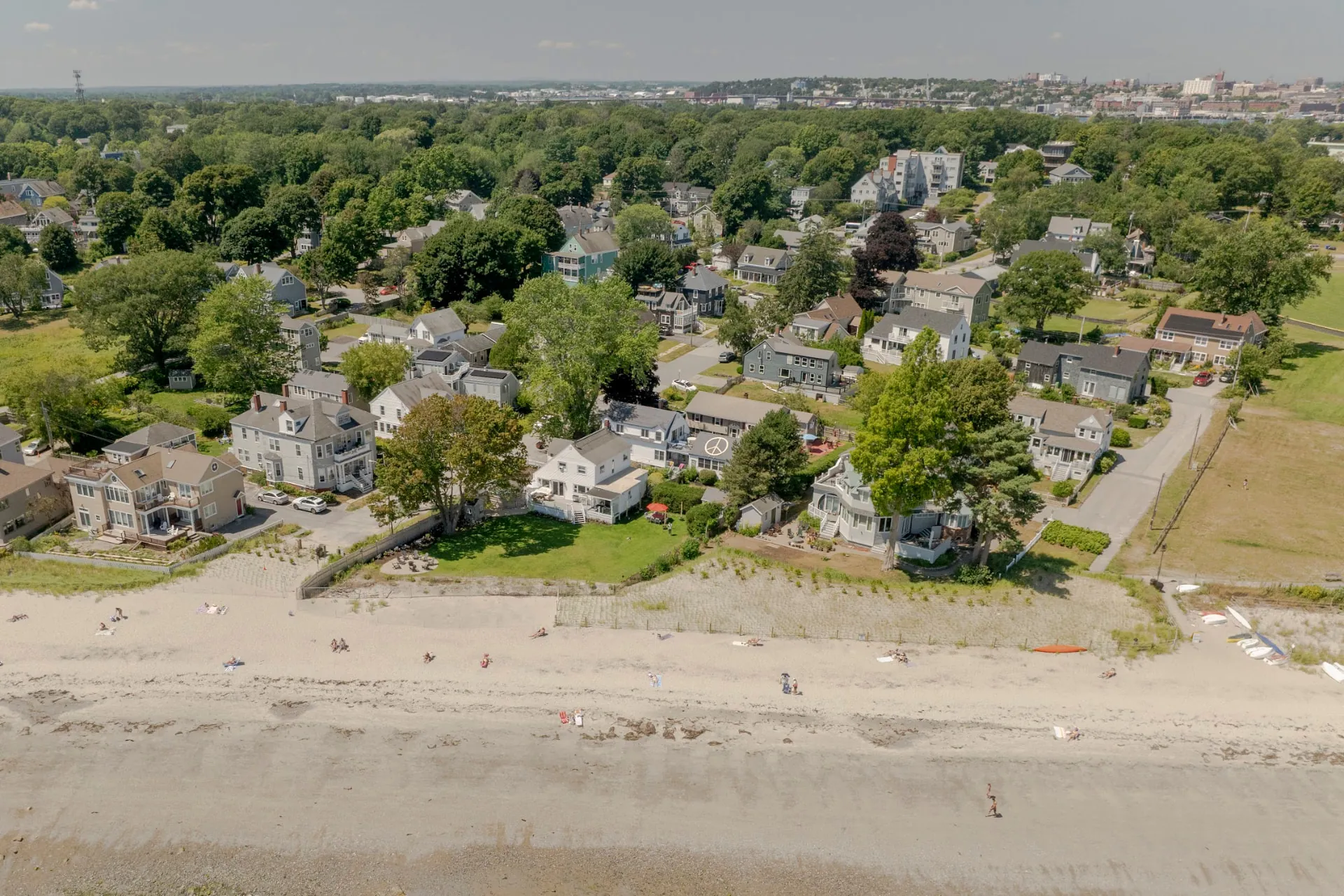 Aerial view of the shoreline at Willard Beach in South Portland, Maine, with homes along the sand